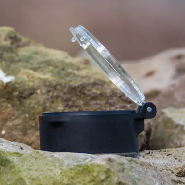 Objective lens flip cap